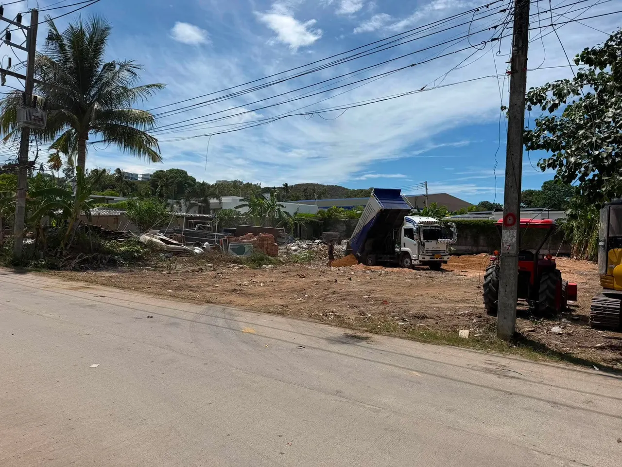Dump truck delivering fill soil to the site