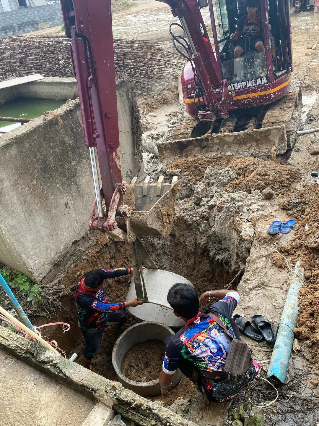 Excavating for underground utilities and service lines at the construction site
