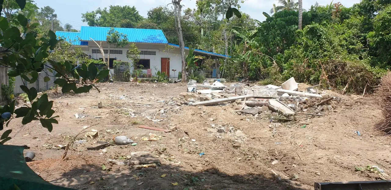 Demolished concrete foundation broken up and ready for removal