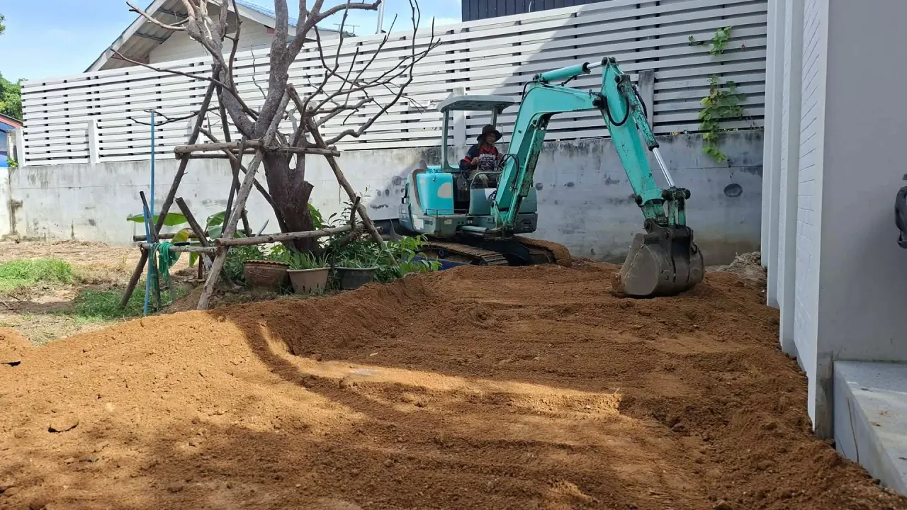 Raising the ground level with imported fill using the excavator