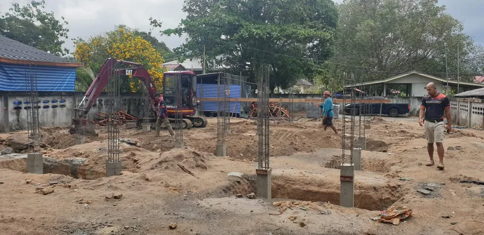 Excavator digging for foundation work on Koh Samui