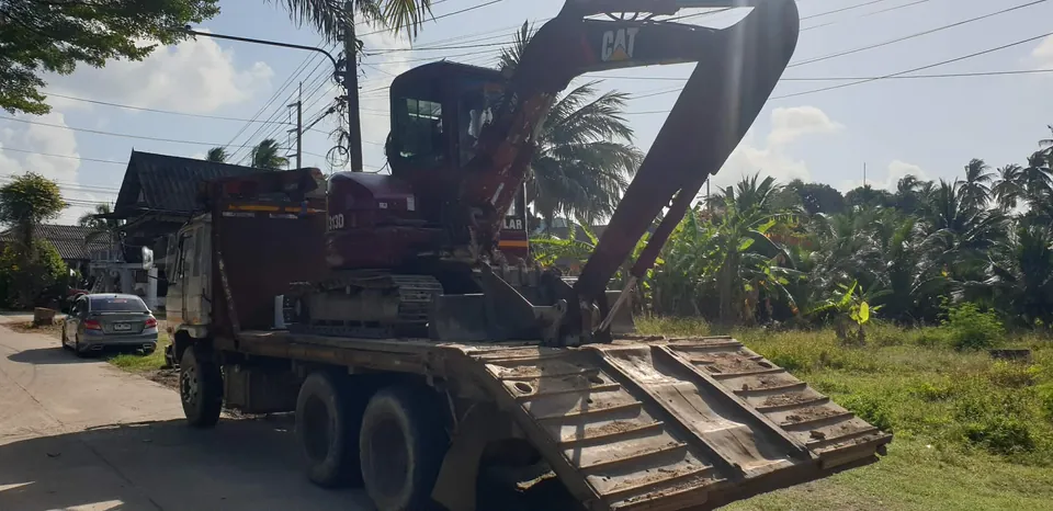 Transporting construction machinery and heavy equipment by truck on Koh Samui